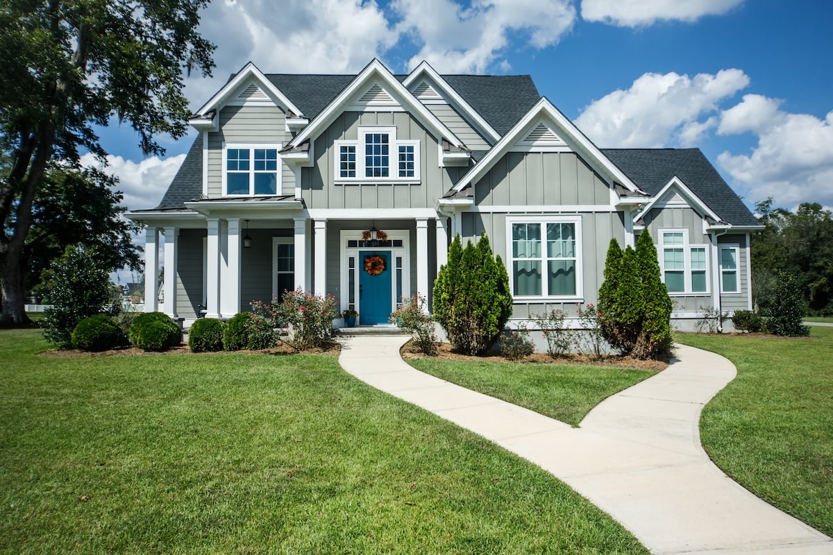 Gray New Construction Modern Cottage Home with Hardy Board Siding and Teal Door with Curb Appeal