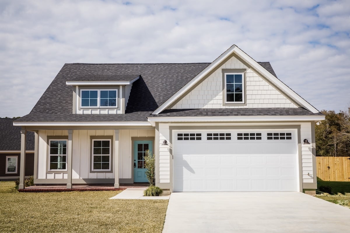 Modern new Construction White Siding Cottage House for Sale in Suburbs with Turquoise Door