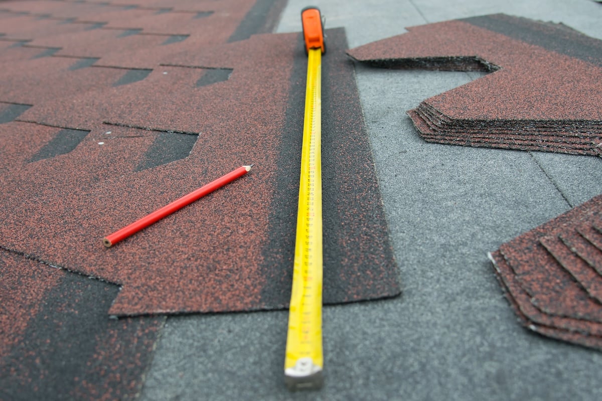 close-up of a meter for measuring a soft roof for making a house roof, red pencil