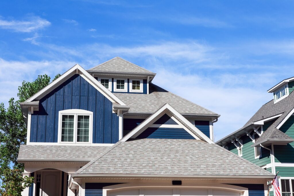 shingle roof cost Close up row of beach houses
