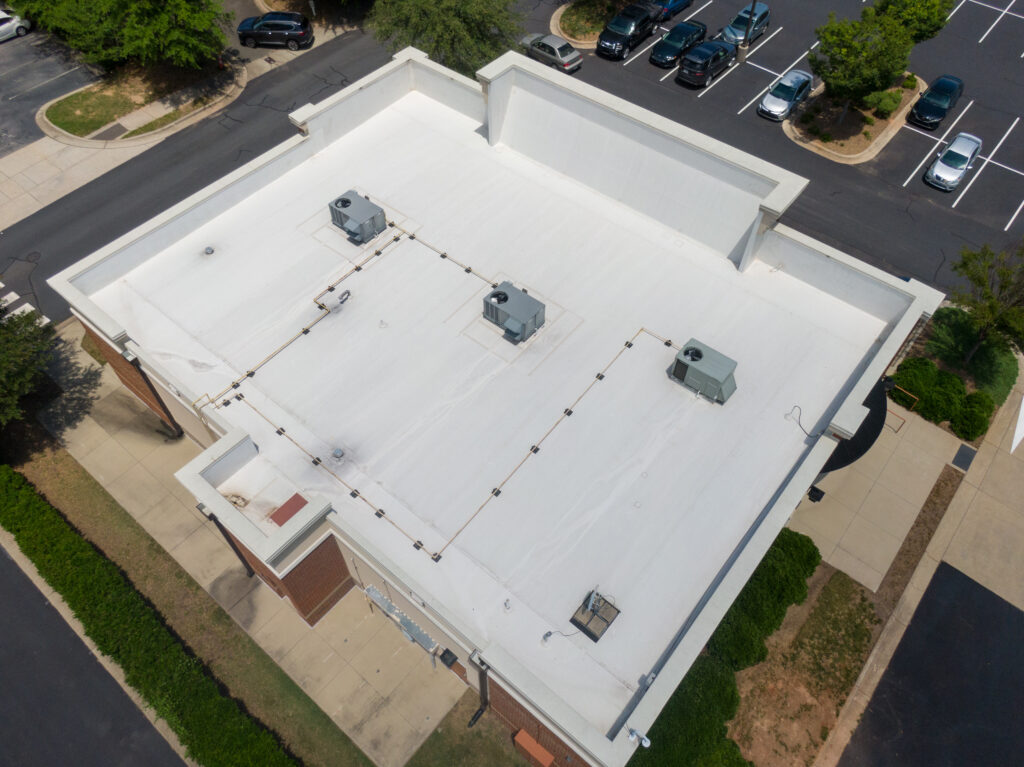 tpo roofing Flat white roof with HVAC units