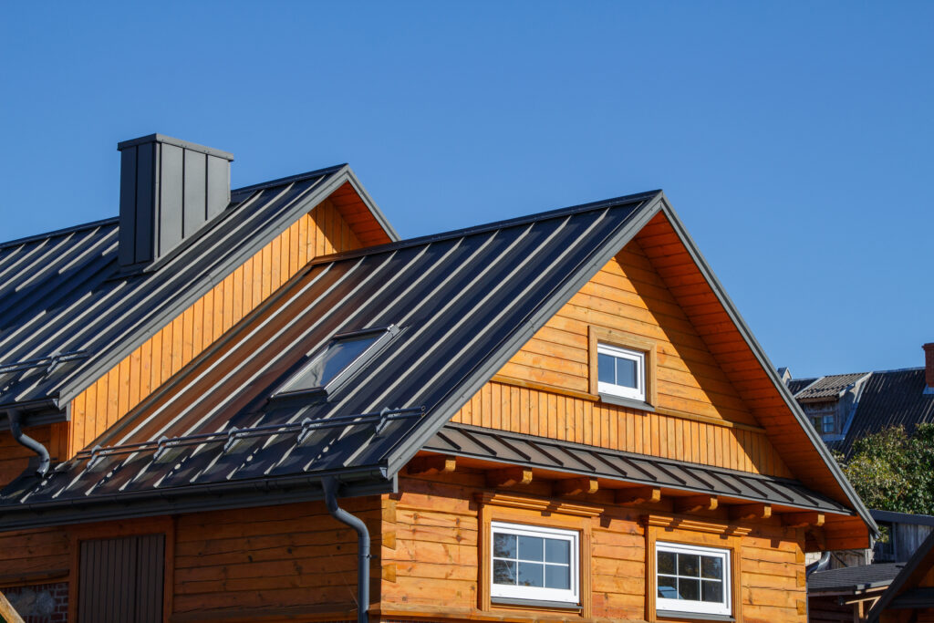 cost of metal roof vs shingle Wooden houses. Classic metal roof. Colorful Houses