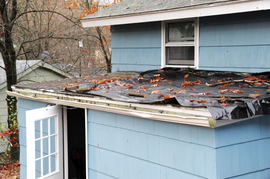 raleigh weather blue house asphalt tiles roof water gutter destroyed after storm