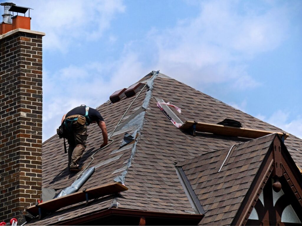 roofing companies garner nc roofer worker repairing brown roof big family house