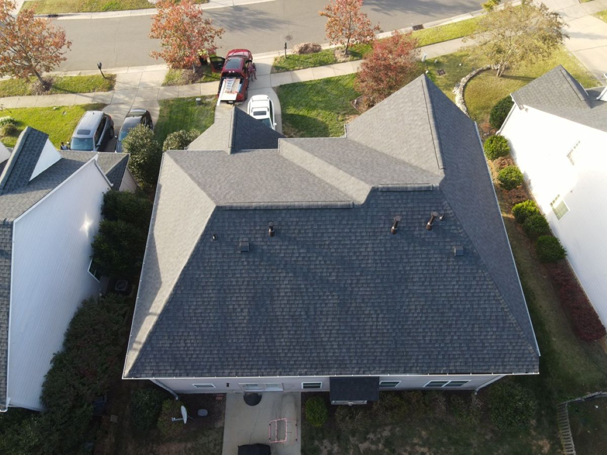 parts of a roof charcoal roof big house car parked