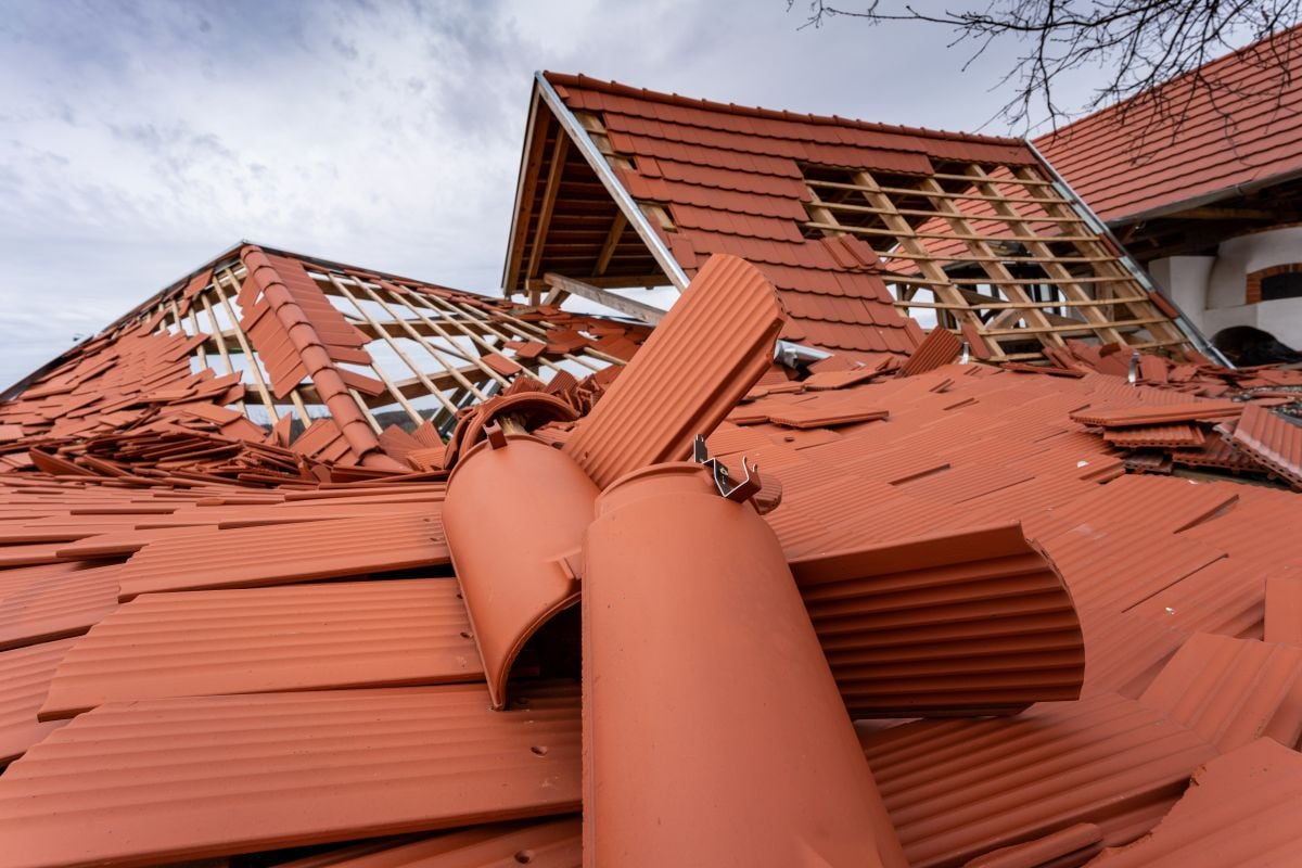 roof damage orange ceramic tiles falling after hurricane