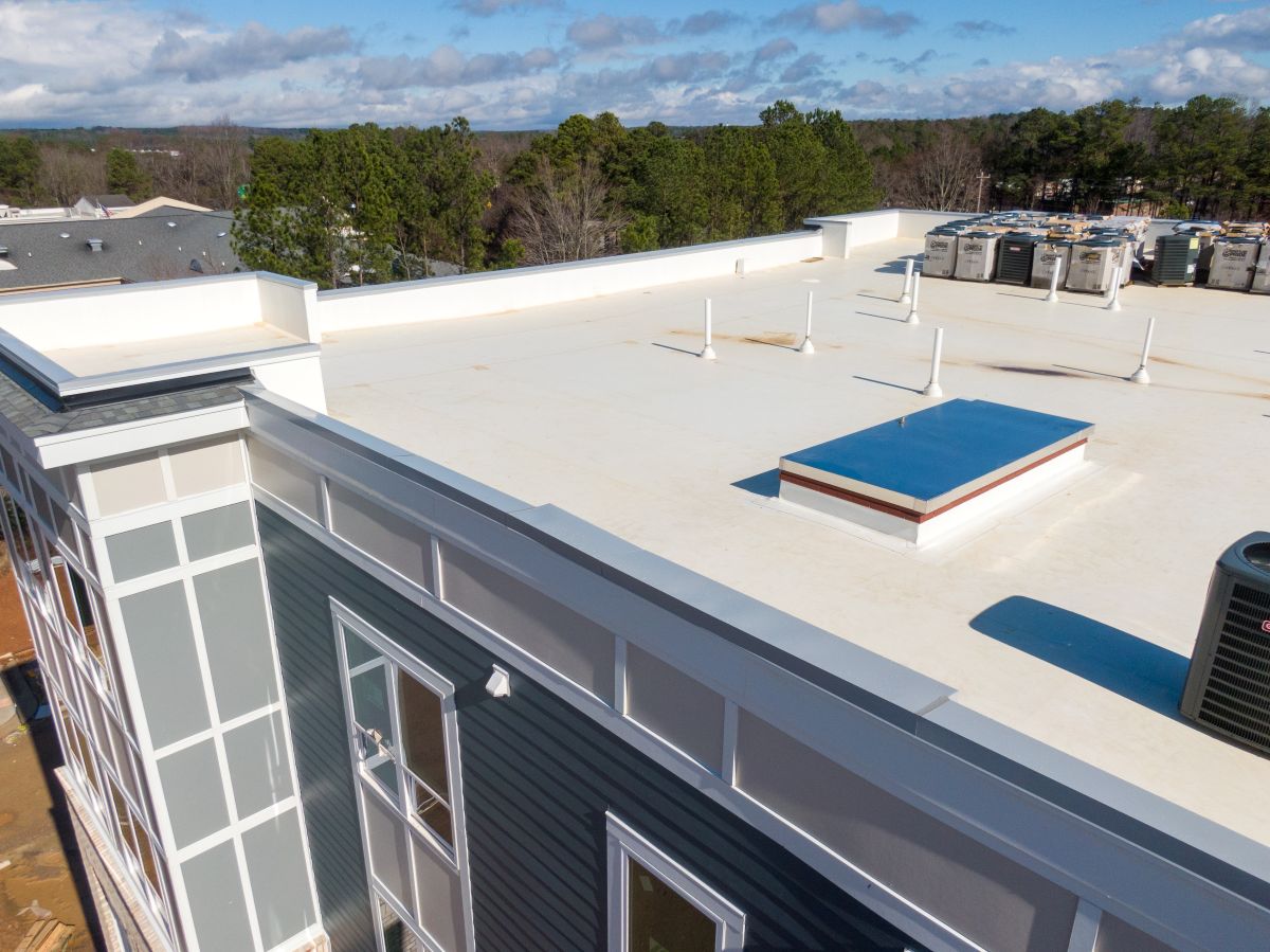 why do commercial buildings have flat roofs HVAC