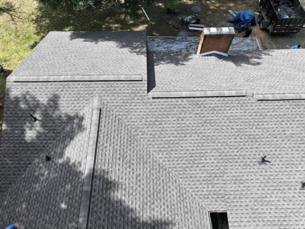Light grey shingle roof with vents