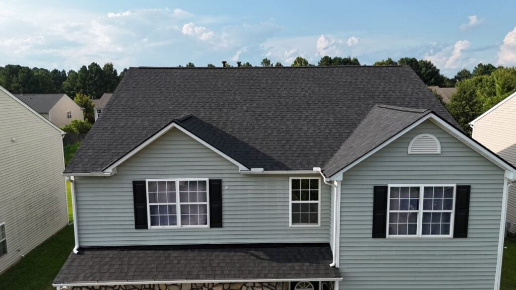 Newly installed dark grey shingle roof