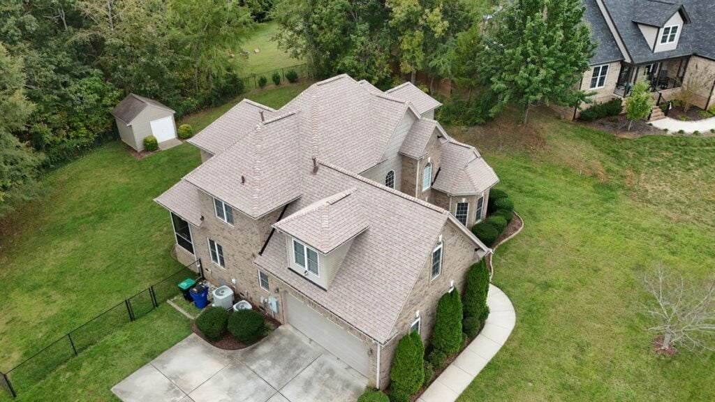 A new shingle roof on a large house