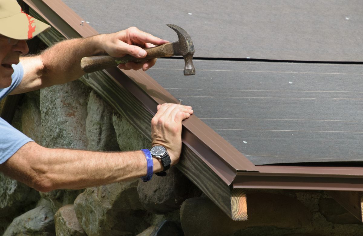 roof drip edge types flashing mature worker using hammer to install roof
