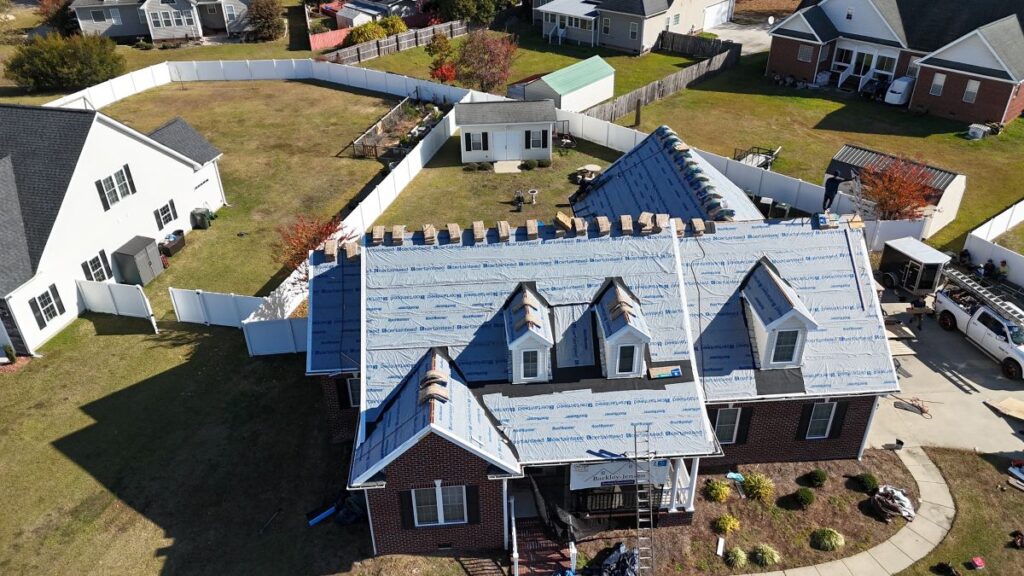 how long does a roof replacement take in holly springs nc Berkley Jensen workers repairing roof