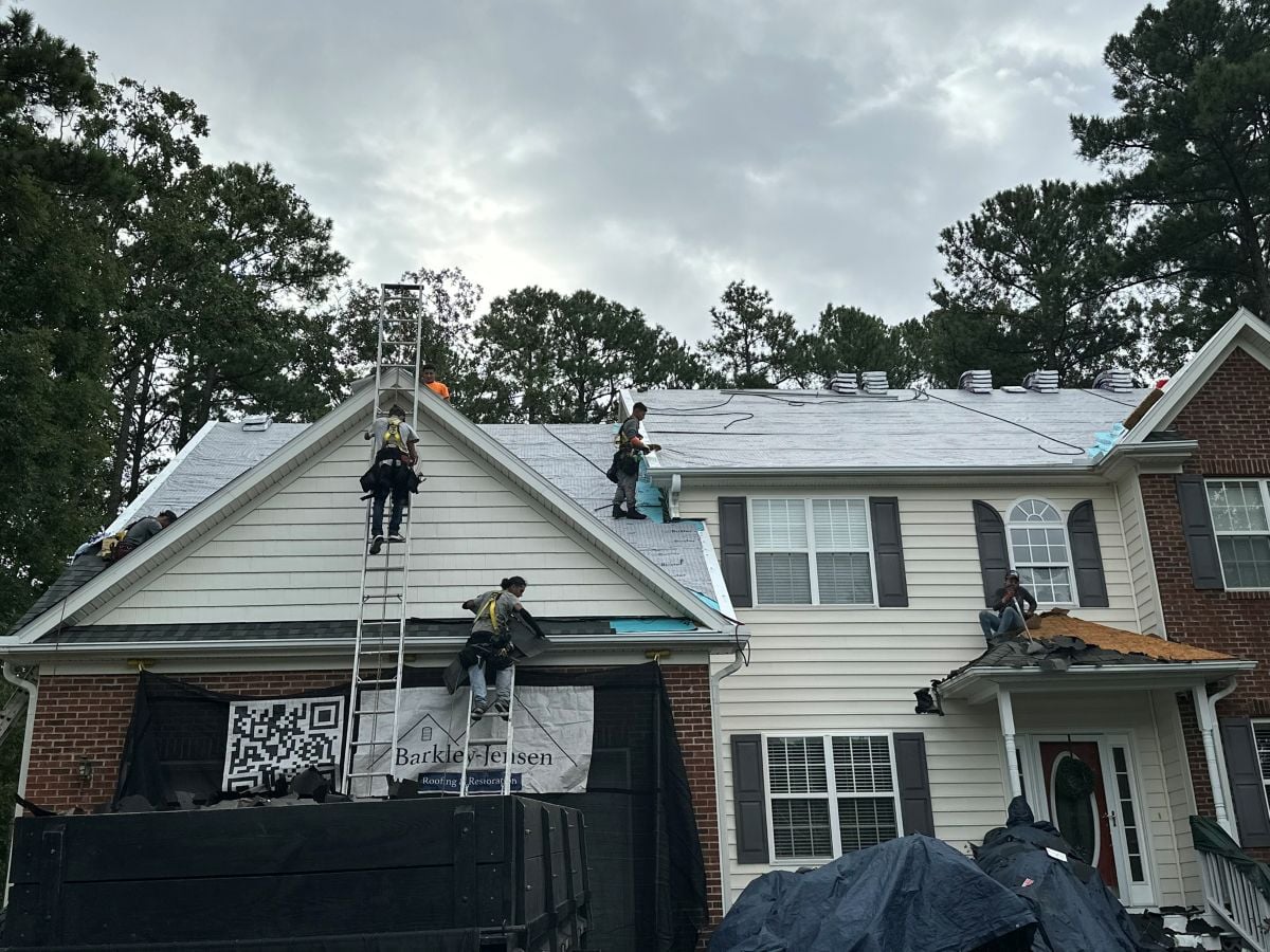 how long does a roof replacement take in holly springs nc Berkley Jensen workers replacing old roof