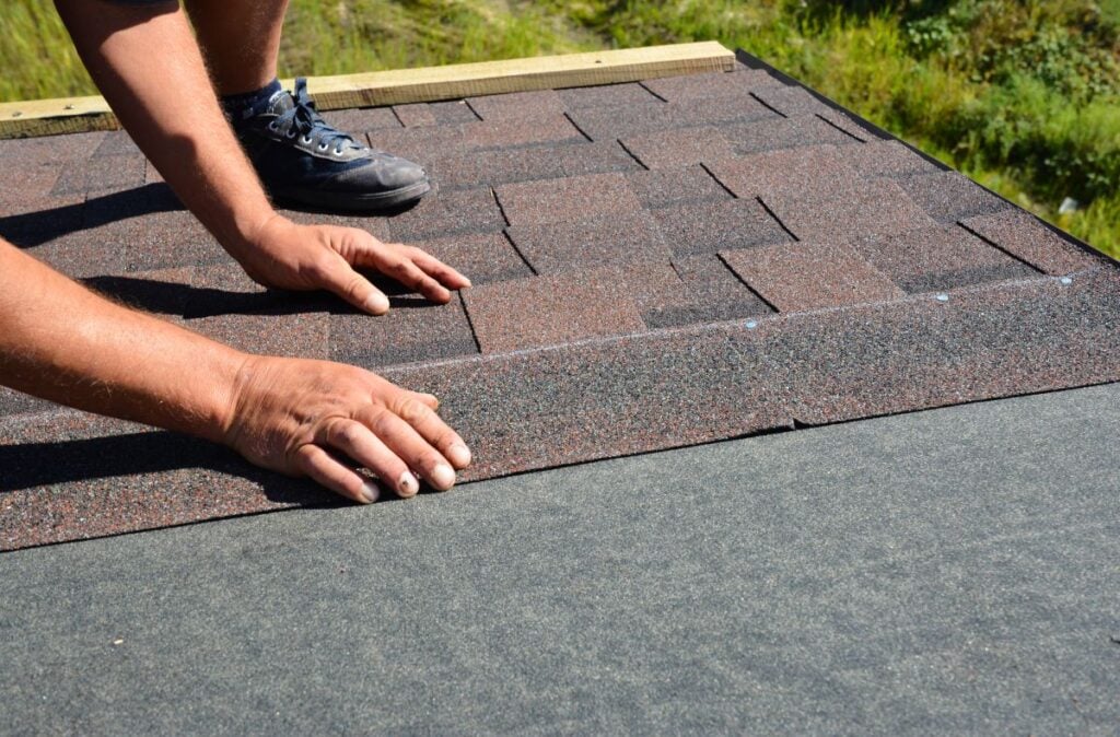 how often should a roof be replaced worker replacing shingles
