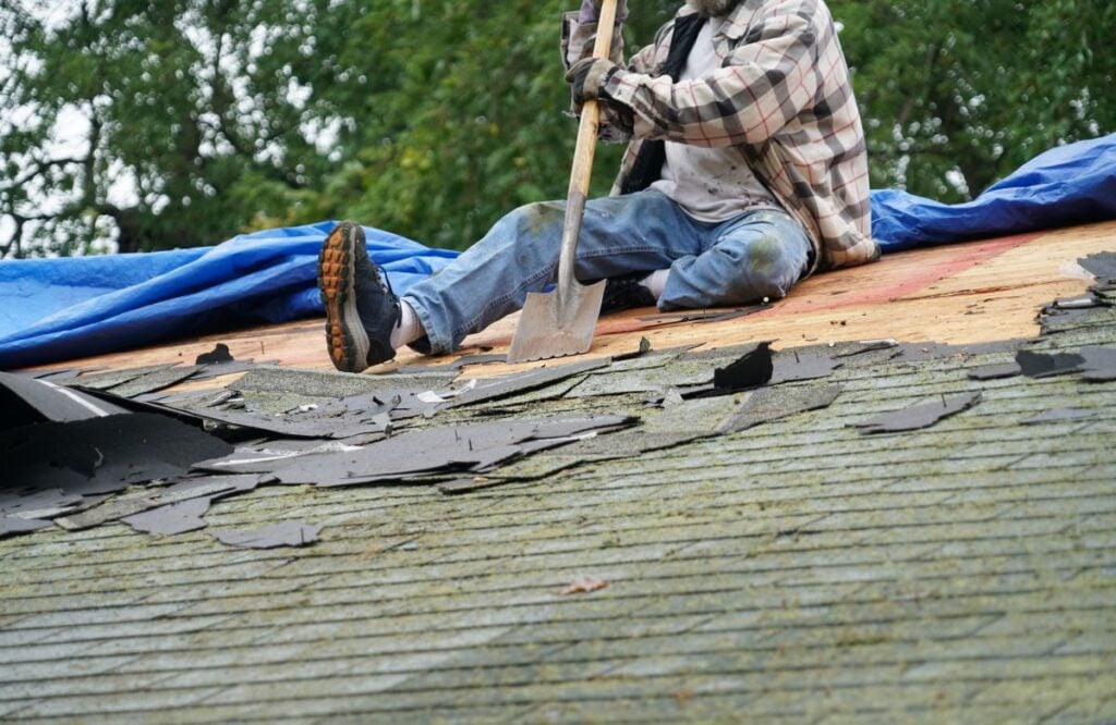 how long does a commercial roof replacement take in raleigh nc worker removing shingles 
