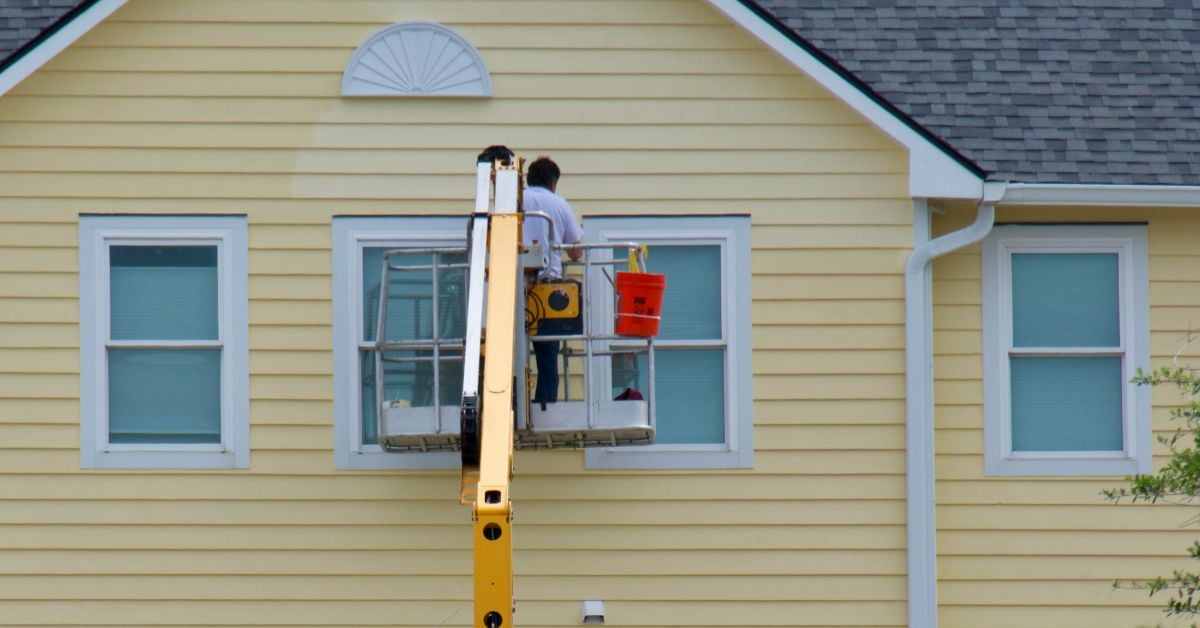 siding garner nc big light yellow house contractor on platform