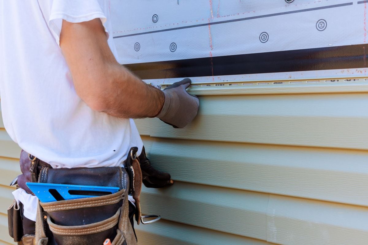 siding mebane nc worker installing new vinyl siding